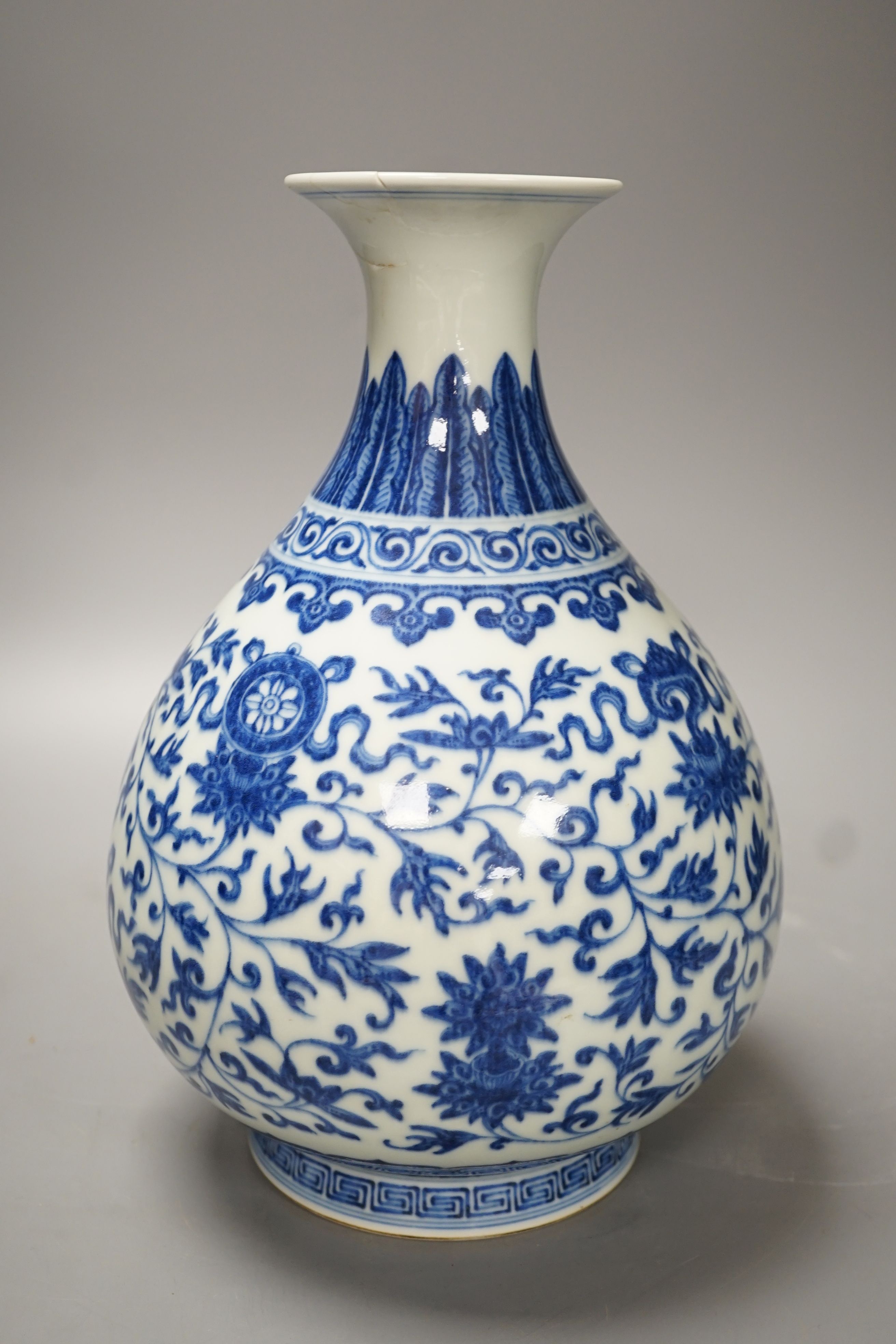 A Chinese blue and white Ming style 'lotus' vase, Yuhuchunping, Qianlong seal mark but 19th century - 28cm high